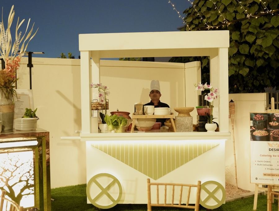 Chef plating a gourmet dish at a Dubai catering event